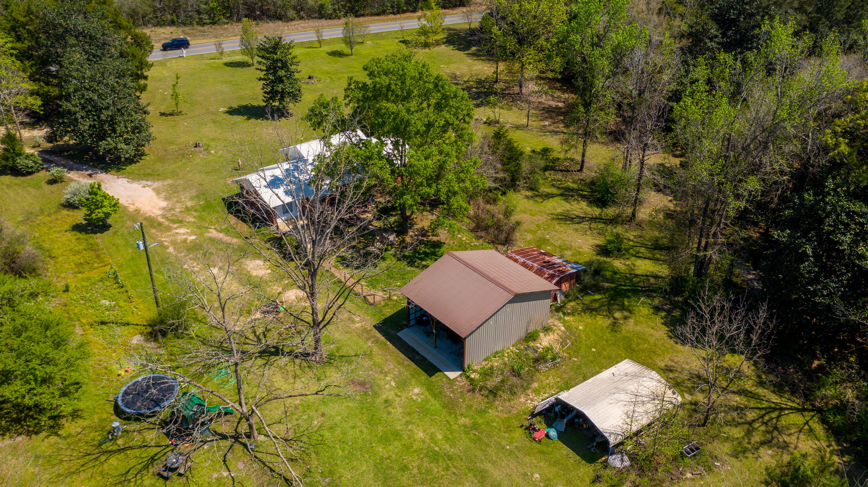 1606 Boy Scout Road DeFuniak Springs, FL 32435 - Photo 8 of 33 an aerial view of a house with a yard swimming pool and lake view