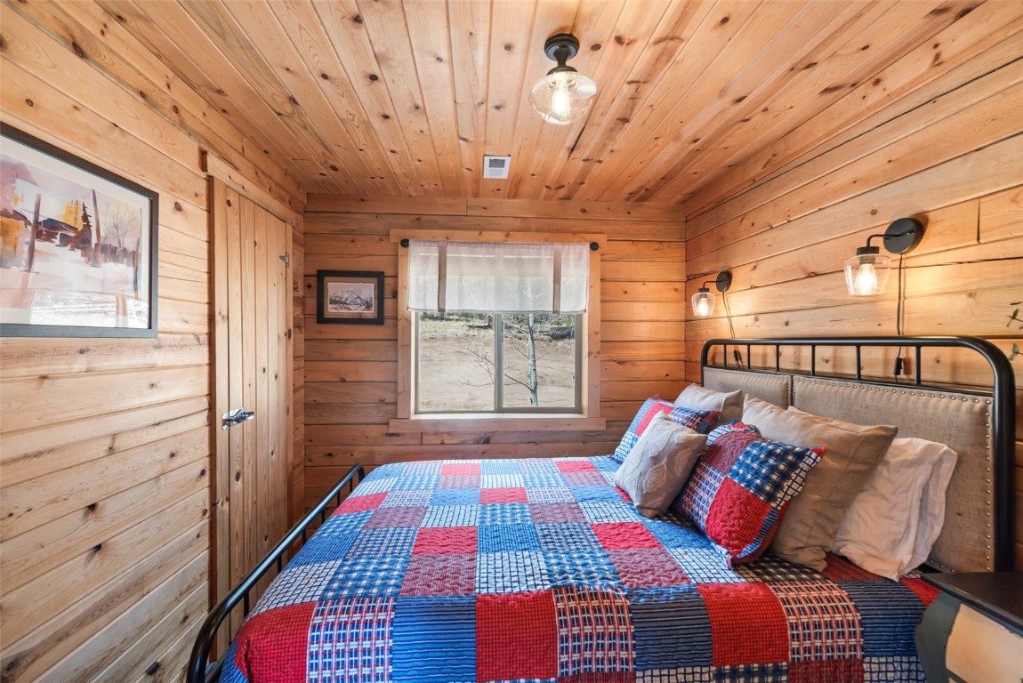 858 Red Cloud Road Como, CO 80456 - Photo 34 of 40 a bedroom with furniture and a window