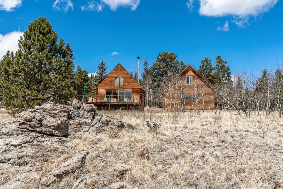 858 Red Cloud Road Como, CO 80456 - Photo 8 of 40 a view of a house with a yard