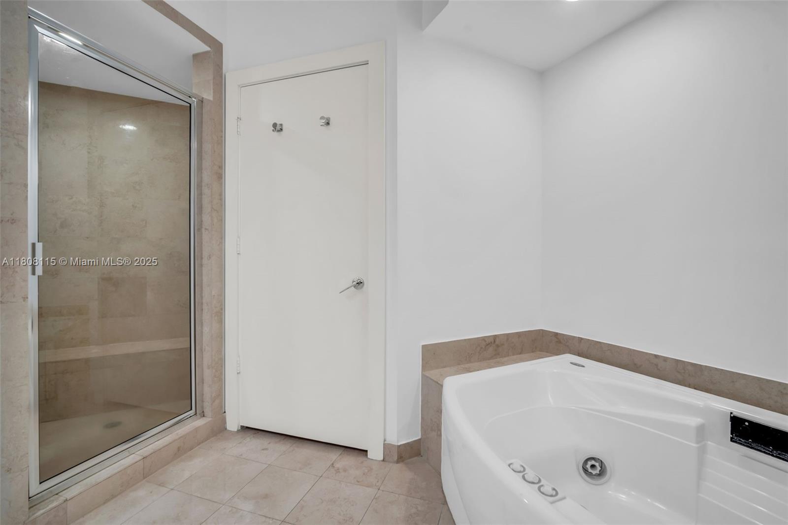 765 Crandon Boulevard, Unit 109 Key Biscayne, FL 33149 - Photo 13 of 21 a bathroom with a bathtub