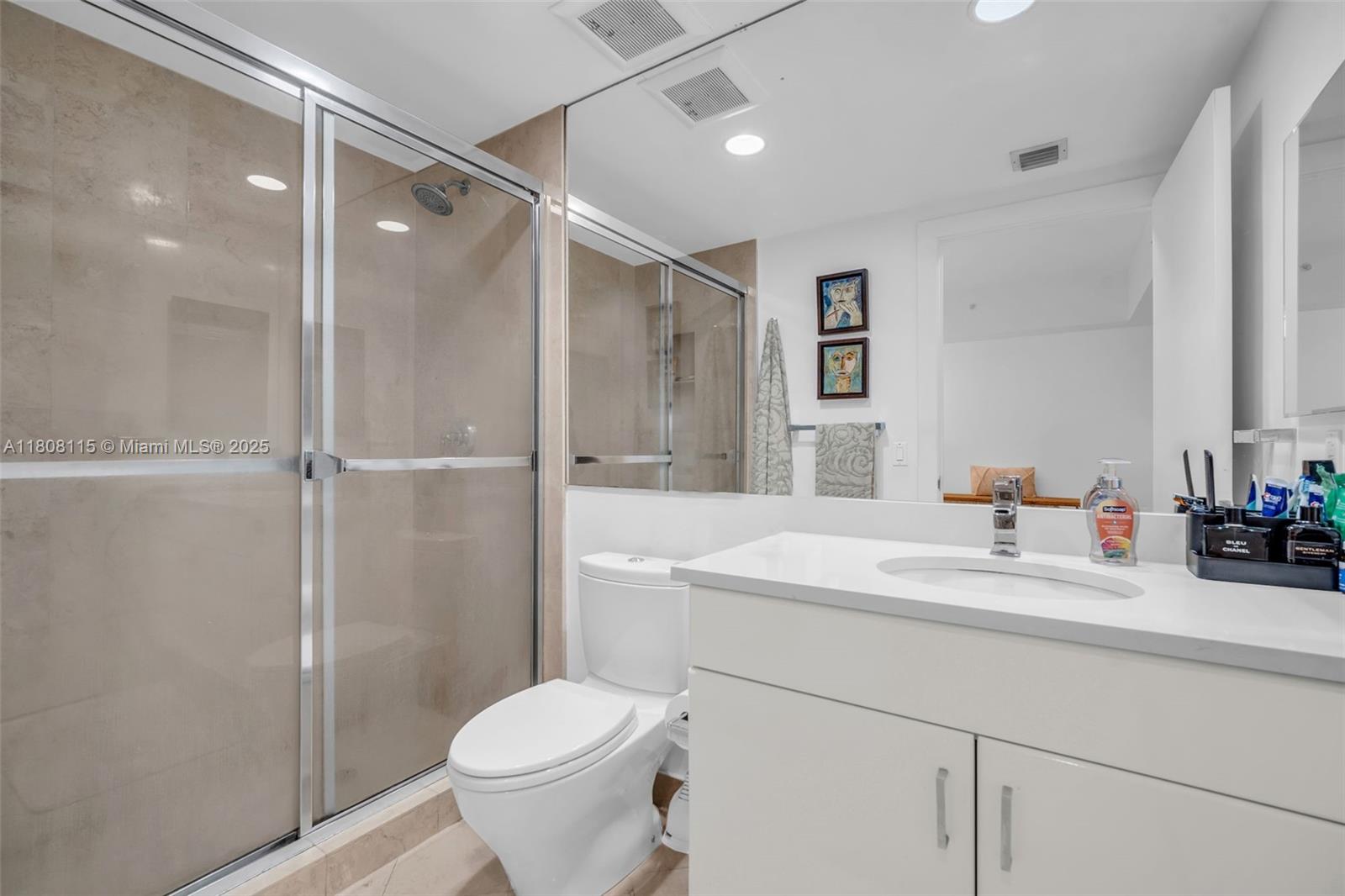 765 Crandon Boulevard, Unit 109 Key Biscayne, FL 33149 - Photo 15 of 21 a bathroom with a sink toilet and shower