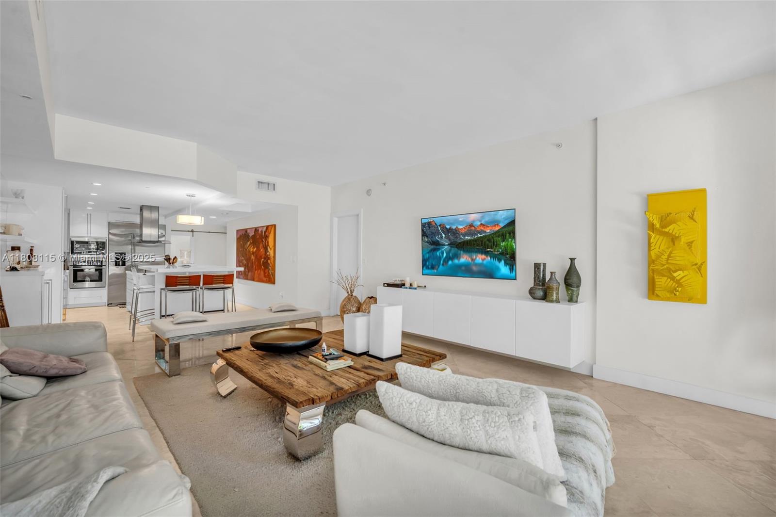 765 Crandon Boulevard, Unit 109 Key Biscayne, FL 33149 - Photo 2 of 21 a living room with furniture and a flat screen tv