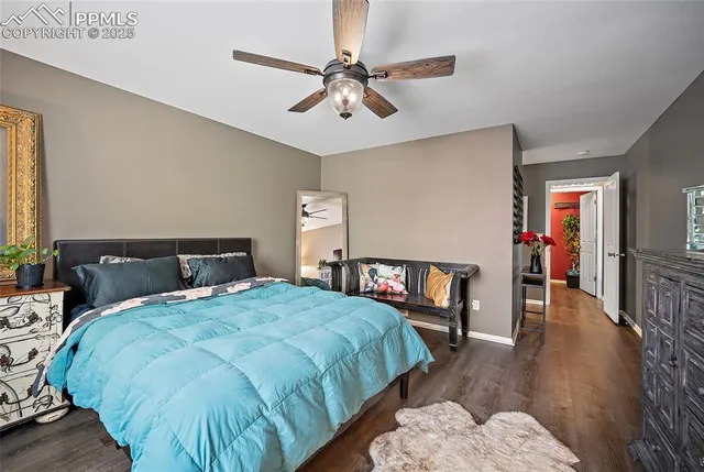 a bedroom with a bed and a table in it