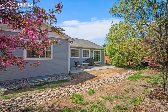 a view of a swimming pool with a table and chairs