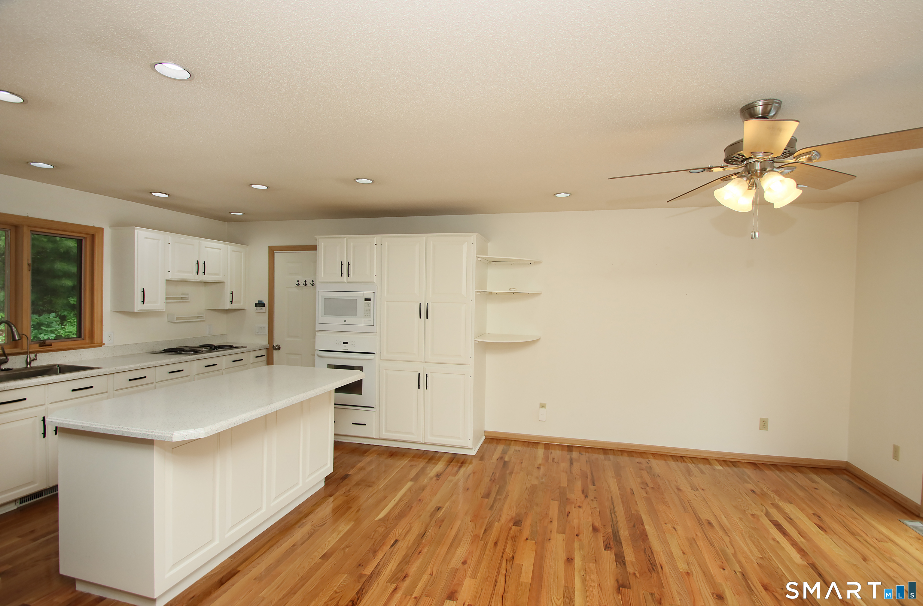 352 Center Street Wolcott, CT 06716 - Photo 13 of 40 a view of kitchen with wooden floor