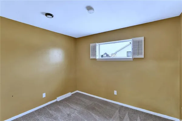 a view of empty room with windows