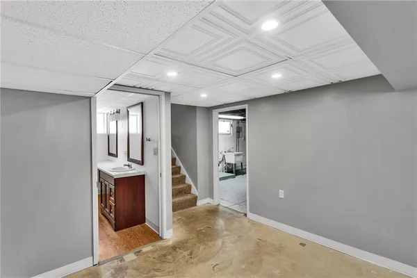 an empty room with wooden floor and glass door