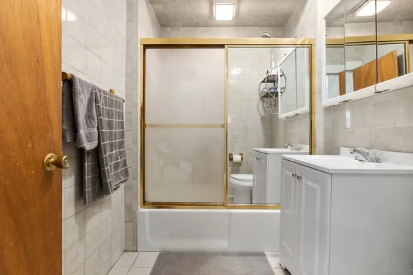 a bathroom with a shower and a sink