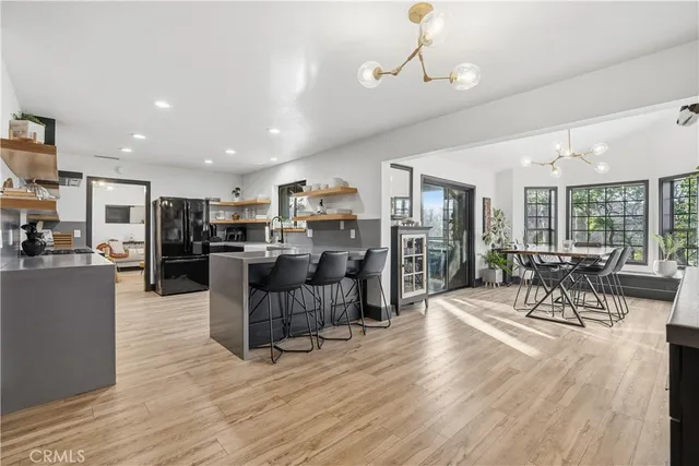 a kitchen with a sink cabinets and window