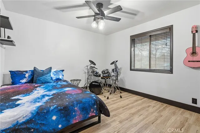 a bedroom with a bed and a table