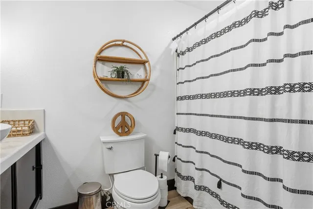 a bedroom with a large bed and a dresser