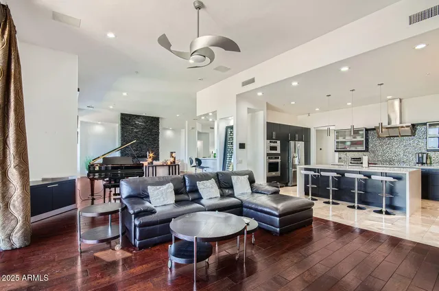 a view of a dining room with furniture and chandelier