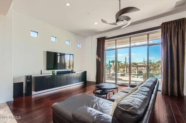a spacious bathroom with a tub sink and mirror