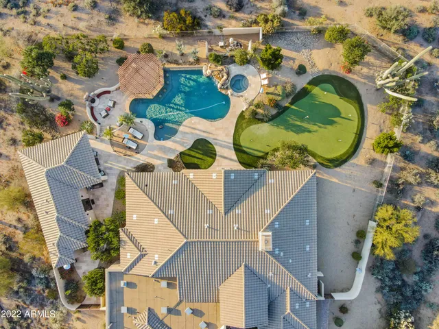 a view of a swimming pool with a garden