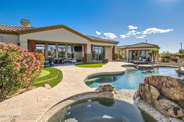 a view of a patio with table and chairs and potted plants