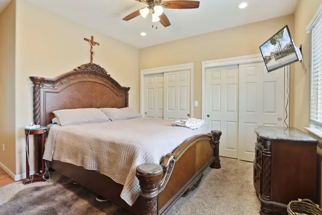 a bedroom with a bed and lamp