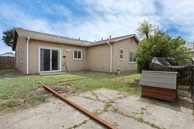 a house view with a backyard space