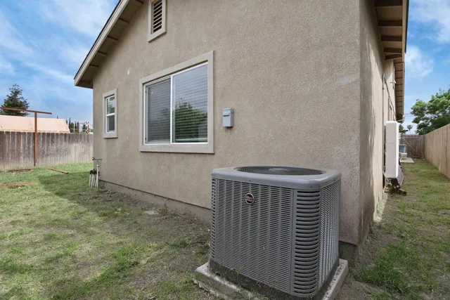 a view of house with backyard