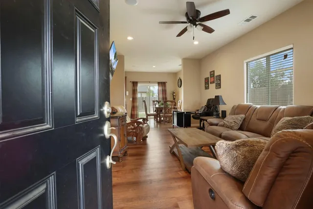 a living room with furniture and a window