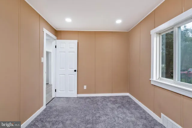 a view of an empty room and window