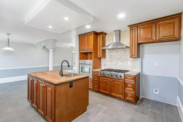 a bathroom with a granite countertop sink a mirror and vanity