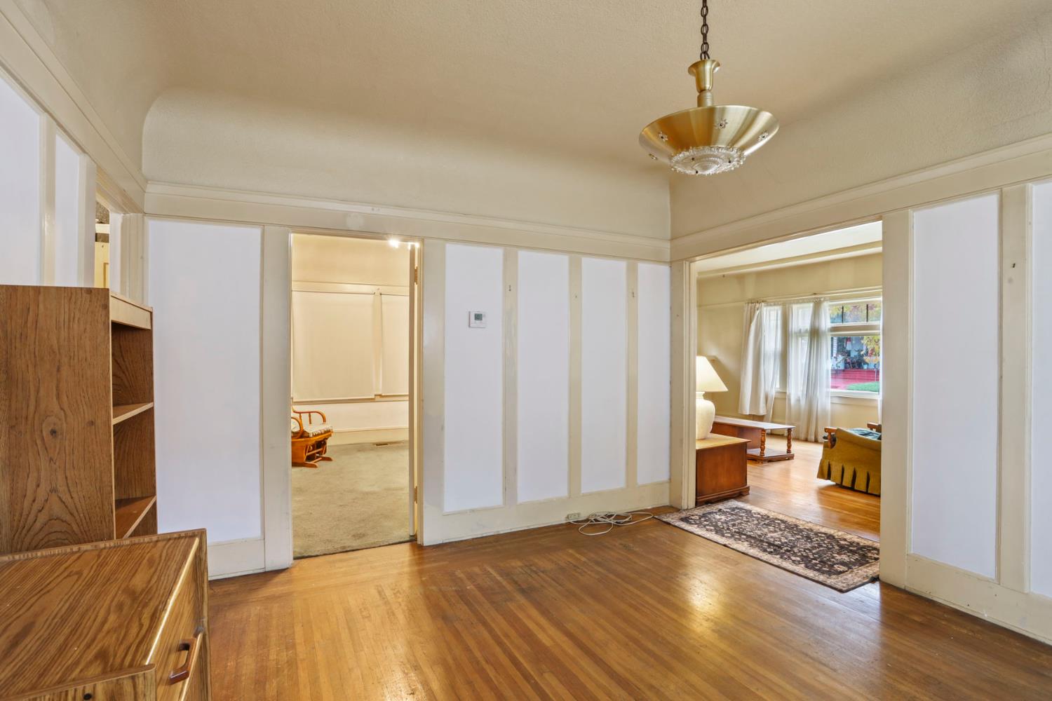1428 West Harding Way Stockton, CA 95203 - Photo 12 of 32 a view of empty room with wooden floor and window