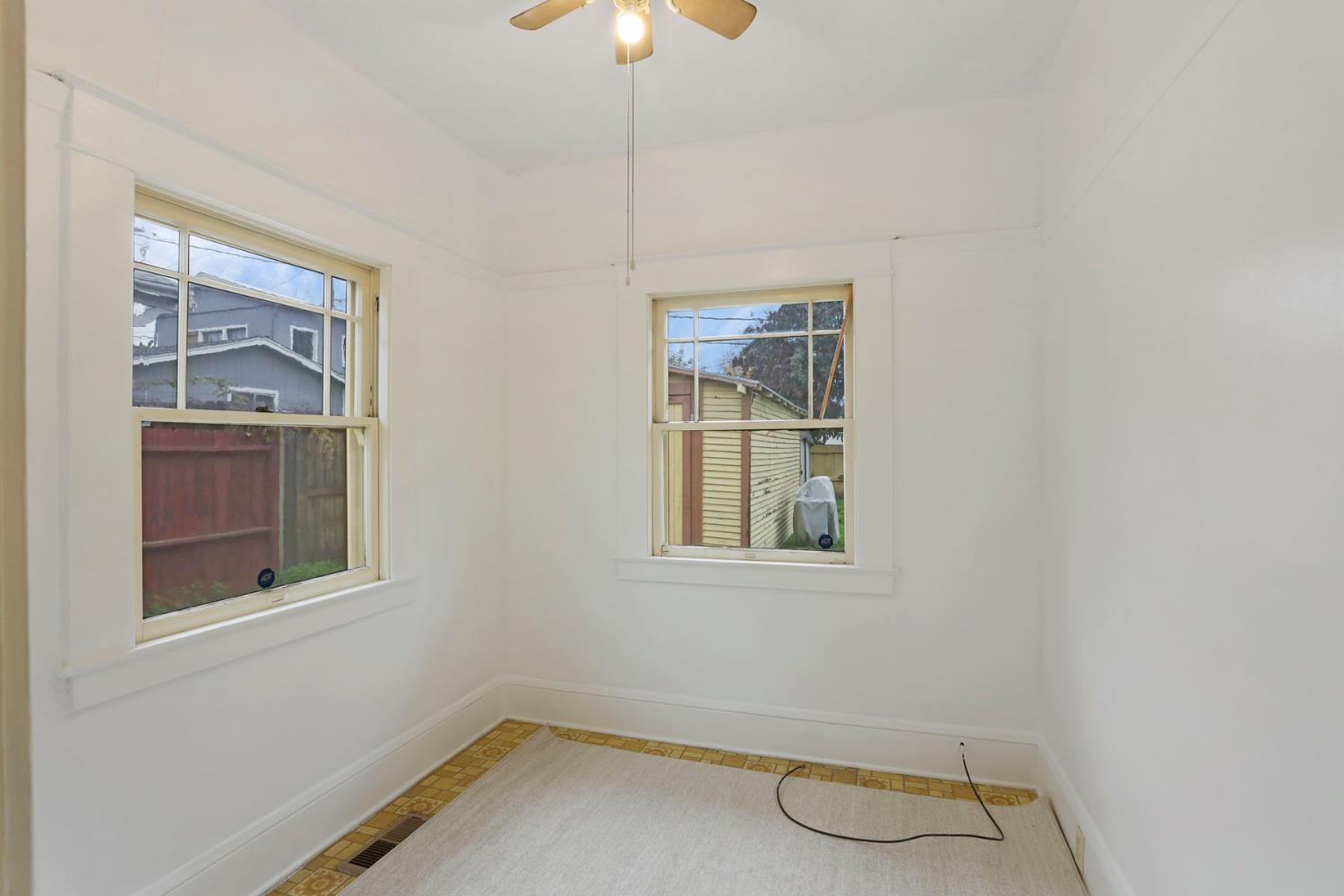 1428 West Harding Way Stockton, CA 95203 - Photo 17 of 32 an empty room with windows