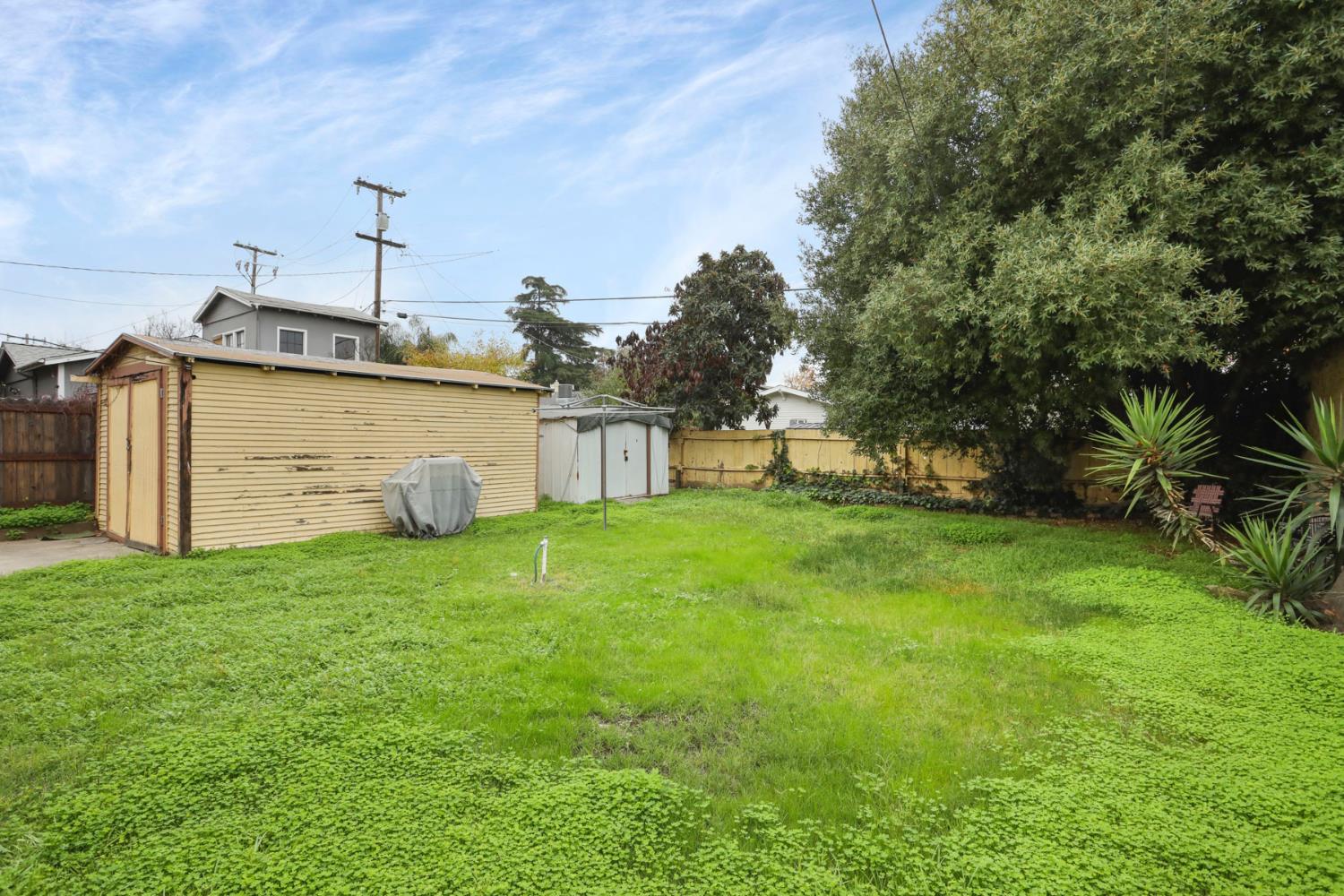 1428 West Harding Way Stockton, CA 95203 - Photo 30 of 32 a view of a house with a backyard