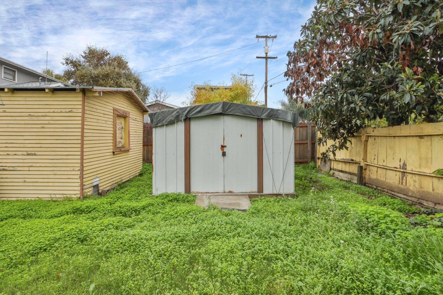 1428 West Harding Way Stockton, CA 95203 - Photo 31 of 32 a view of a house with a yard
