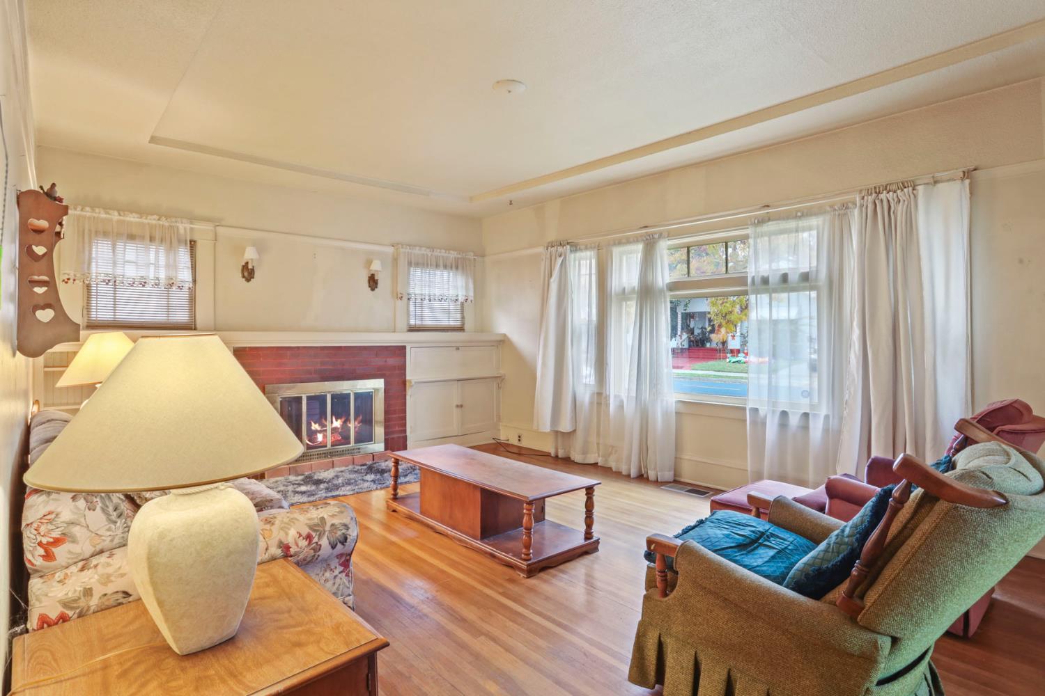 1428 West Harding Way Stockton, CA 95203 - Photo 10 of 32 a living room with furniture and wooden floor