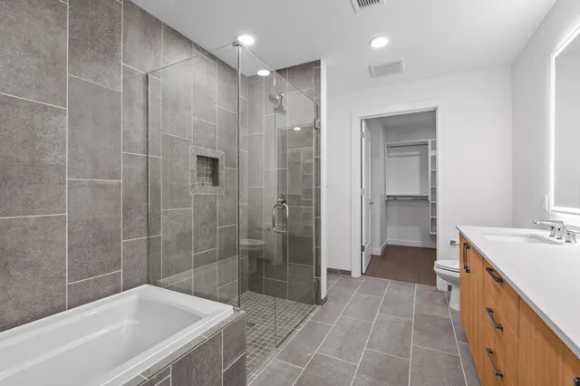 a bathroom with a bathtub and a sink