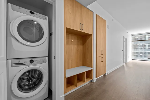 a view of a hallway with washer and dryer