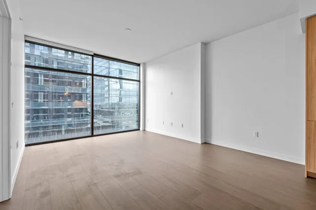 a view of an empty room with glass door