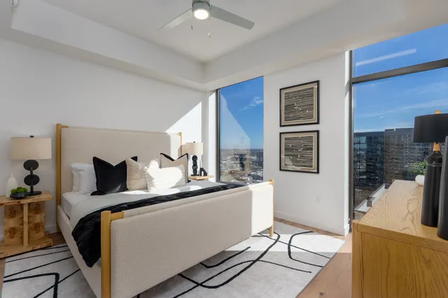 a bedroom with furniture and a fireplace