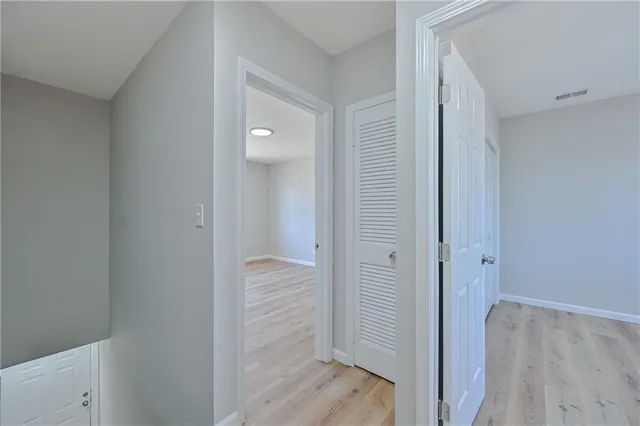 a view of a bathroom with wooden floor