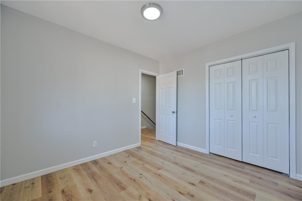 955 Tilden Street Northwest Atlanta, GA 30318 - Photo 21 of 25 a view of an empty room and wooden floor