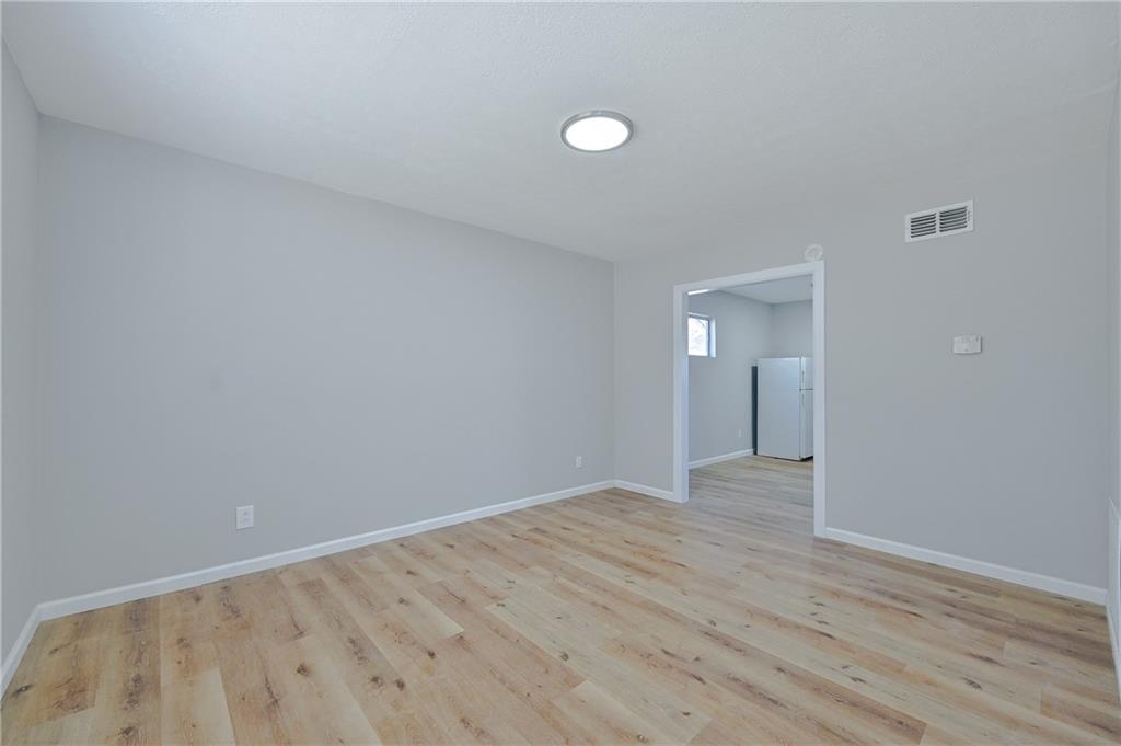955 Tilden Street Northwest Atlanta, GA 30318 - Photo 3 of 25 a view of an empty room and window