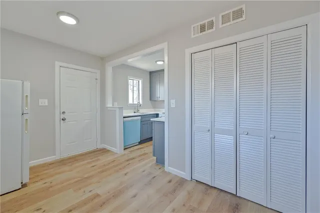 a view of a kitchen with a sink and cabinets