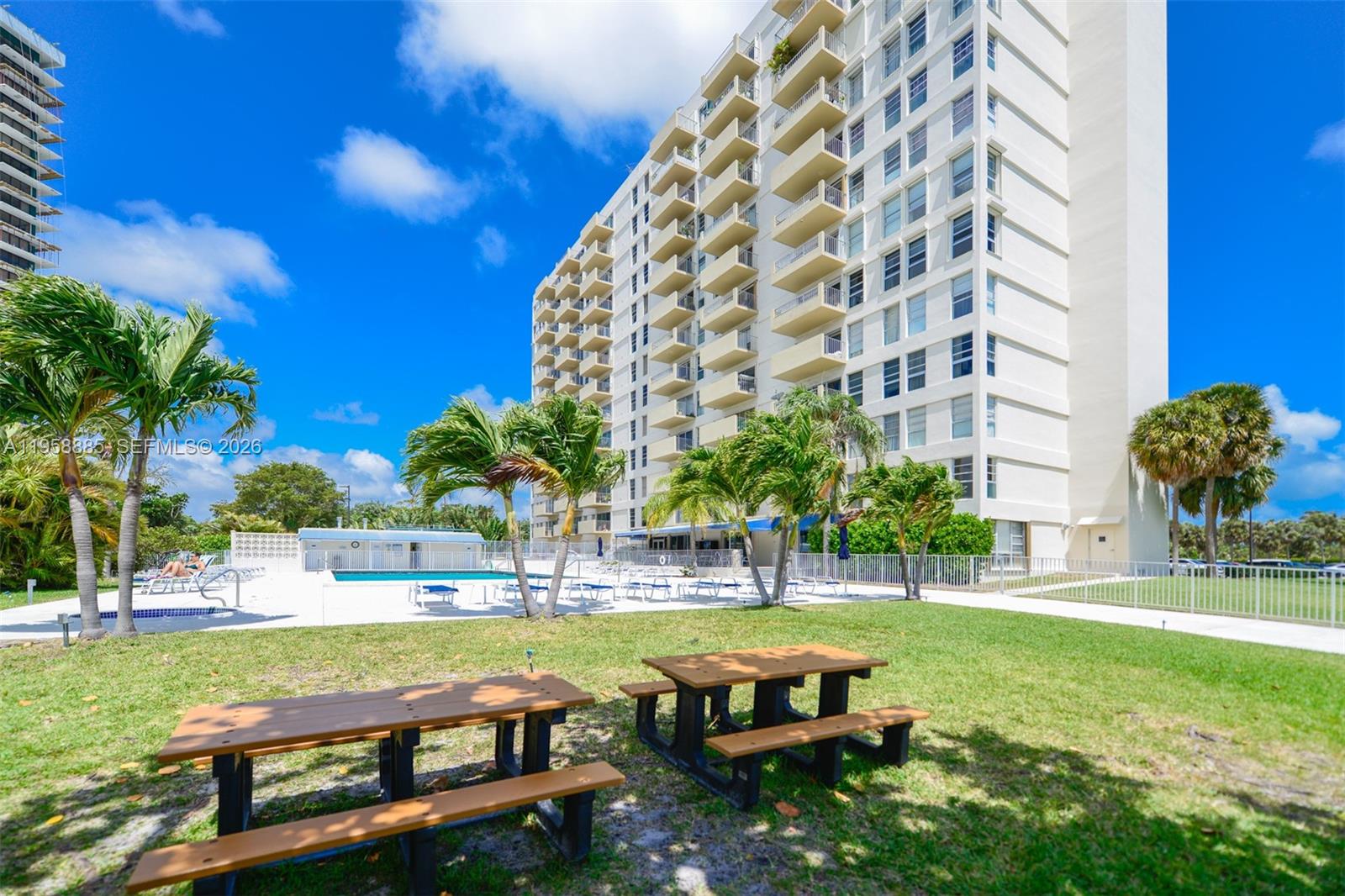 880 Northeast 69th Street, Unit 2N Miami, FL 33138 - Photo 12 of 23 a swimming pool with outdoor seating and yard
