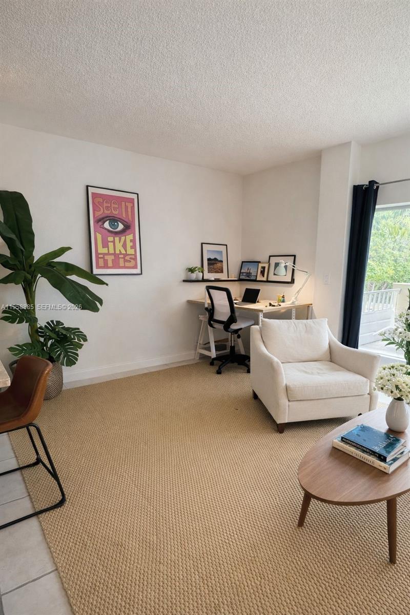 880 Northeast 69th Street, Unit 2N Miami, FL 33138 - Photo 18 of 23 a living room with furniture and a potted plant
