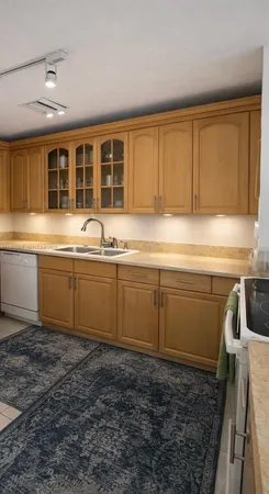 a kitchen with a sink and cabinets