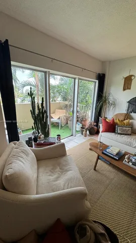 a view of a backyard with wooden floor and a fire pit