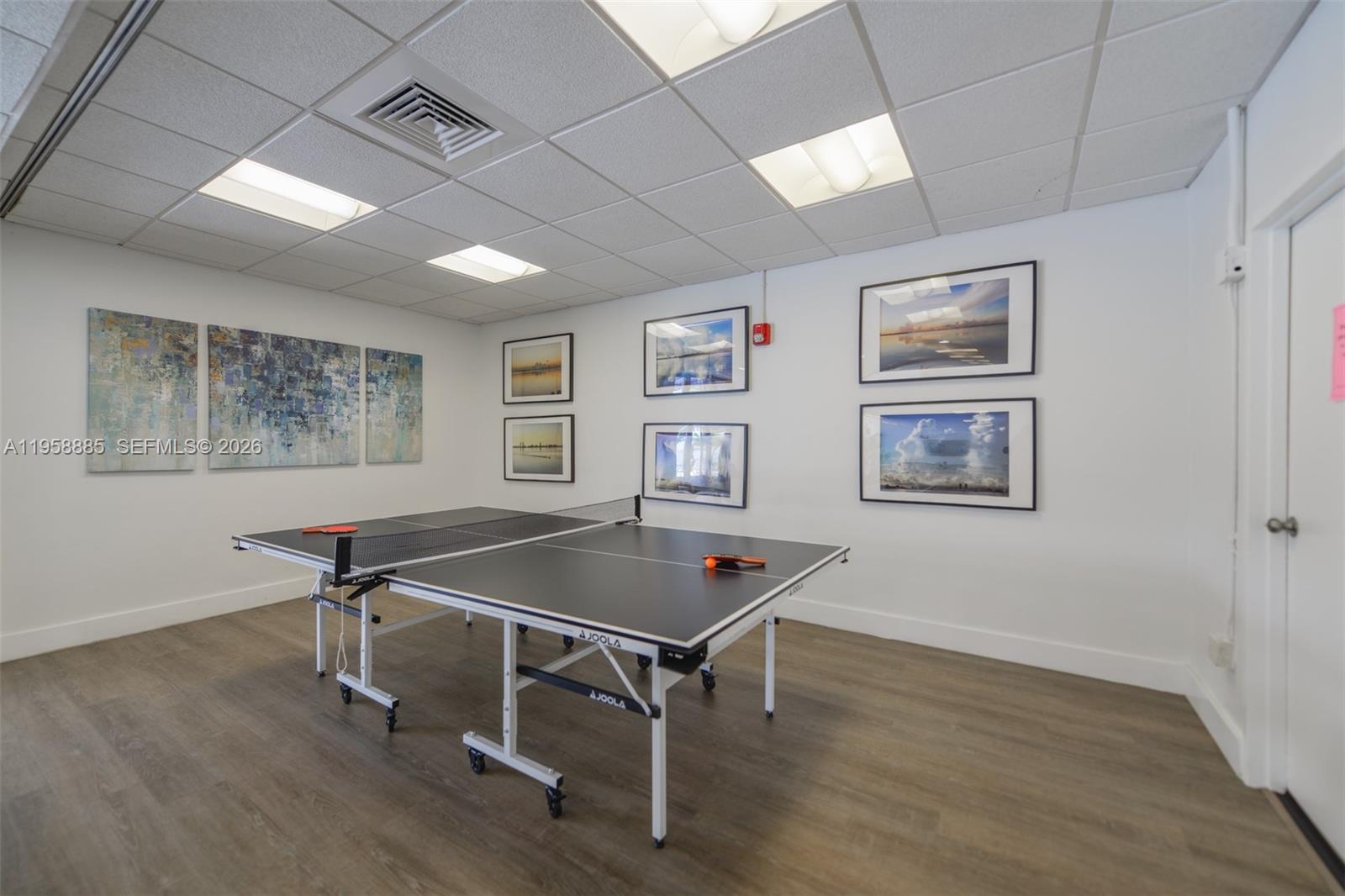 880 Northeast 69th Street, Unit 2N Miami, FL 33138 - Photo 4 of 23 a living room with furniture pool table and a table