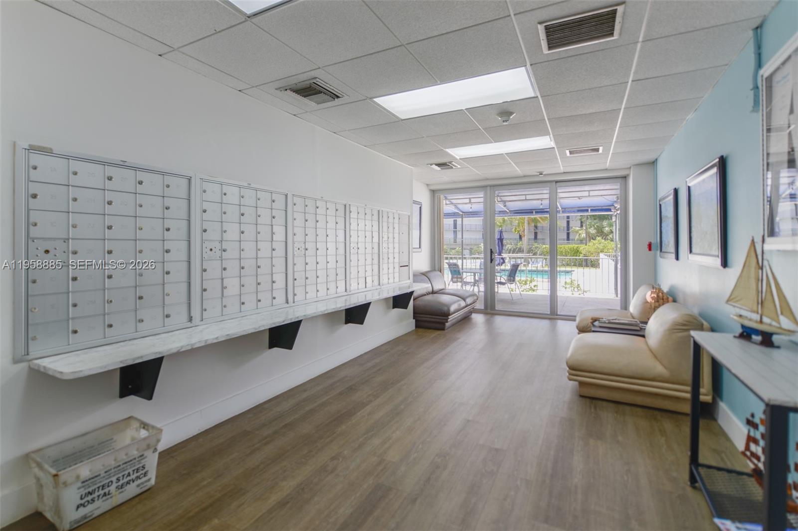 880 Northeast 69th Street, Unit 2N Miami, FL 33138 - Photo 5 of 23 a living room with furniture and a large window