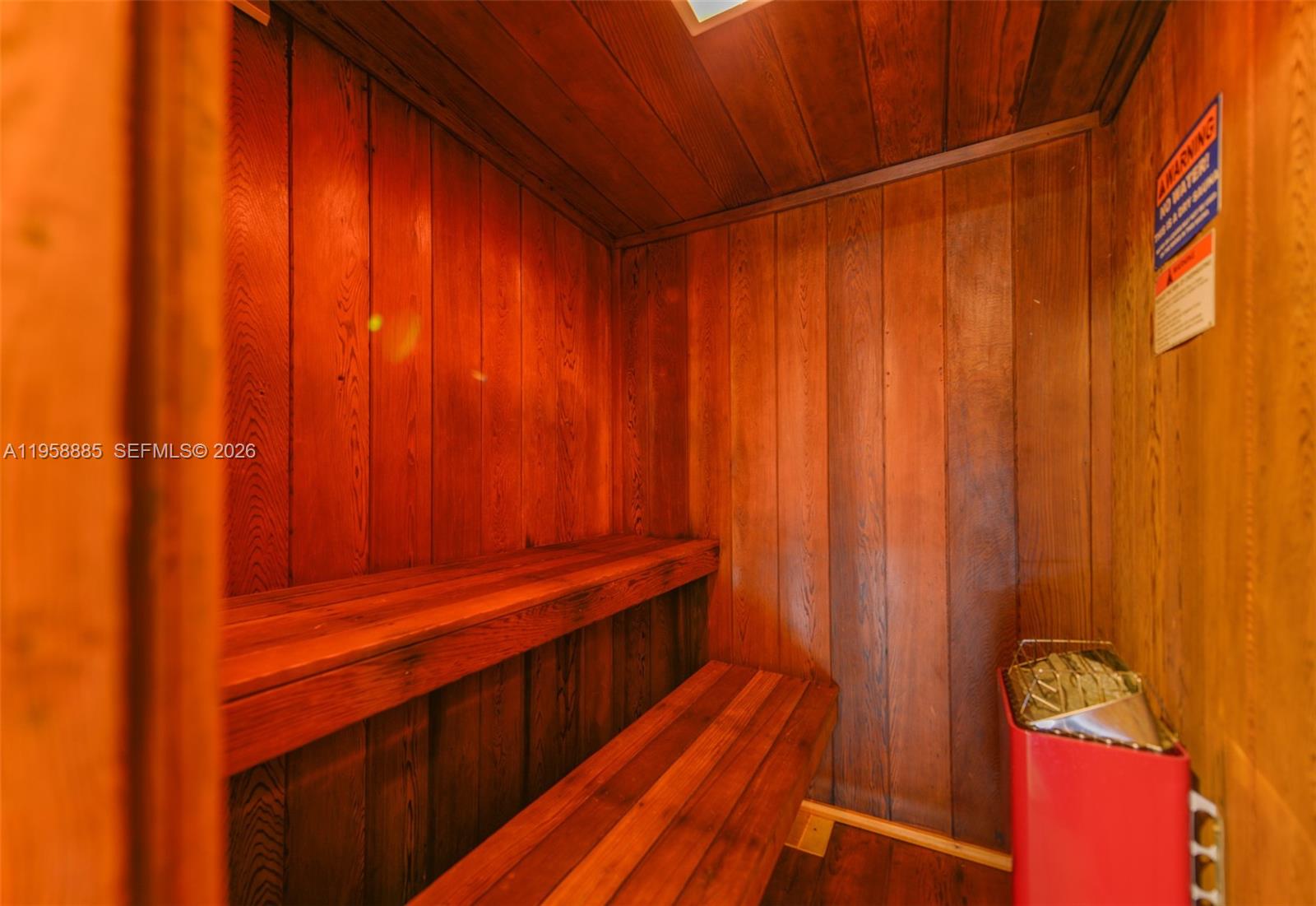 880 Northeast 69th Street, Unit 2N Miami, FL 33138 - Photo 7 of 23 a view of a room with wooden walls
