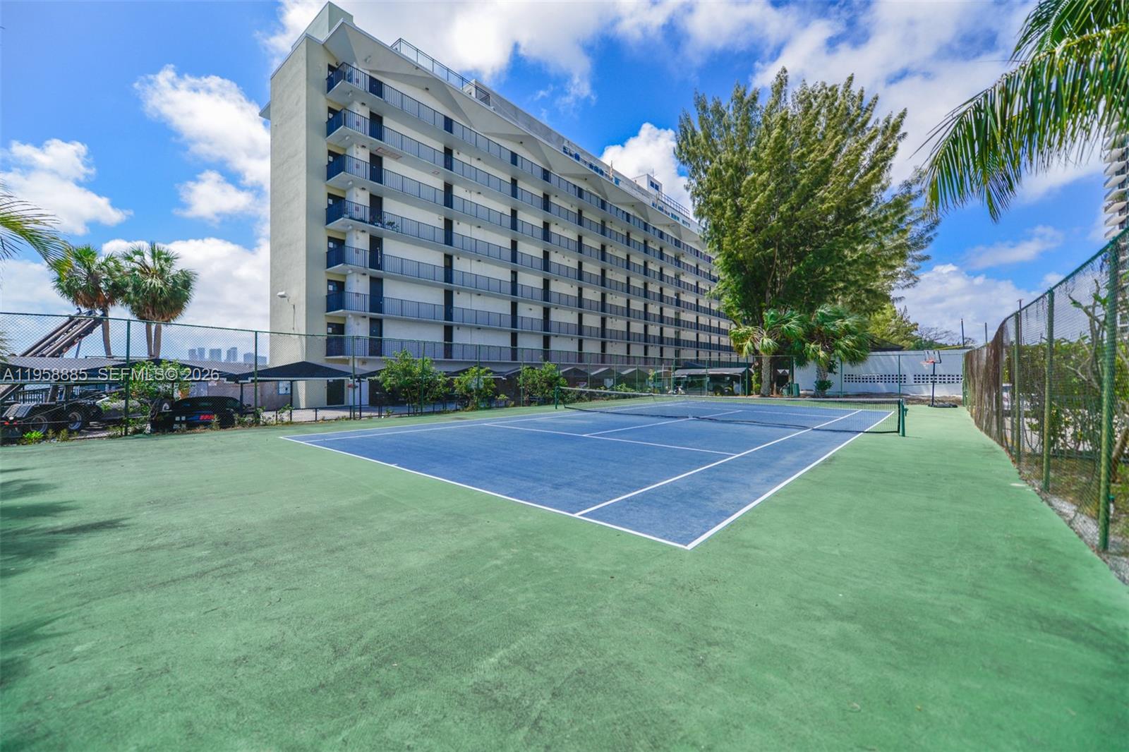 880 Northeast 69th Street, Unit 2N Miami, FL 33138 - Photo 8 of 23 a view of a tall building with a yard