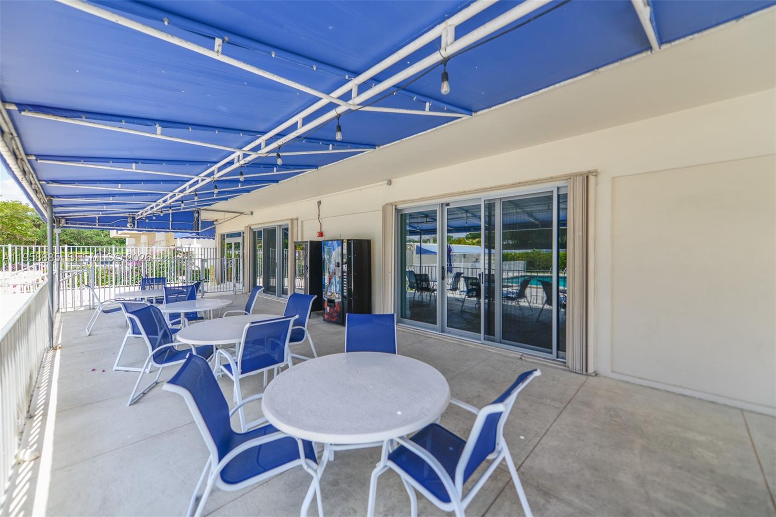 880 Northeast 69th Street, Unit 2N Miami, FL 33138 - Photo 10 of 23 a dining room with furniture wooden floor and a rug