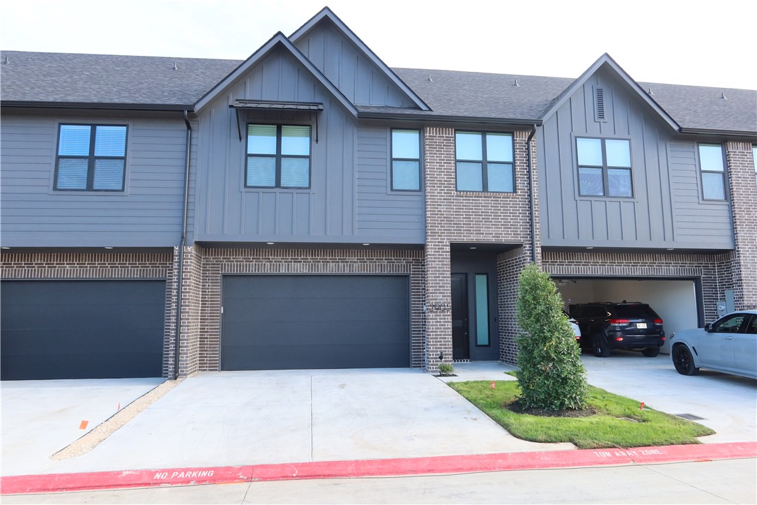 2905 Huffman Way College Station, TX 77845 - Photo 1 of 37 a front view of a house with a garden and a garage