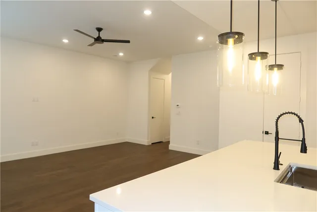 a bathroom with a shower and a sink