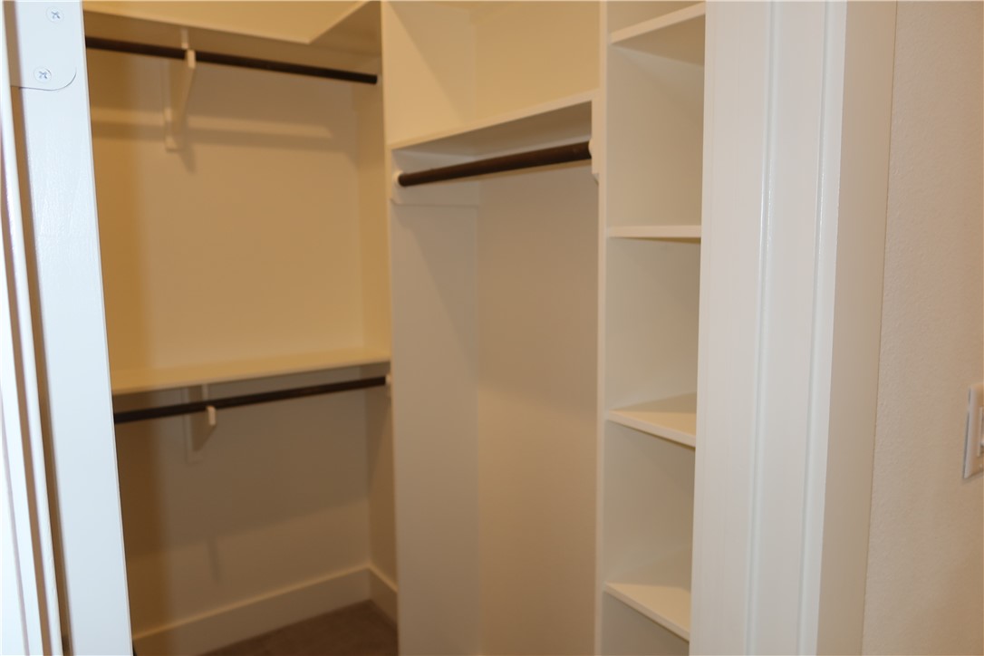 2905 Huffman Way College Station, TX 77845 - Photo 20 of 37 a view of walk in closet with empty racks